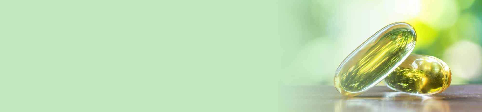 Two yellow, soft gelatin capsules. 